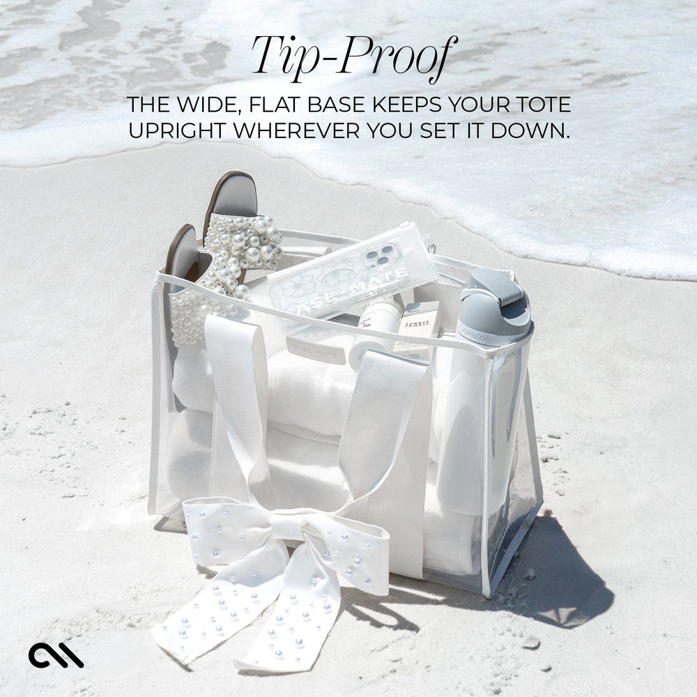 TIP-PROOF WITH A WIDE FLAT BASE THAT KEEPS YOUR TOTE UPRIGHT WHEREVER YOU SET IT DOWN #color_ivory pearl bow