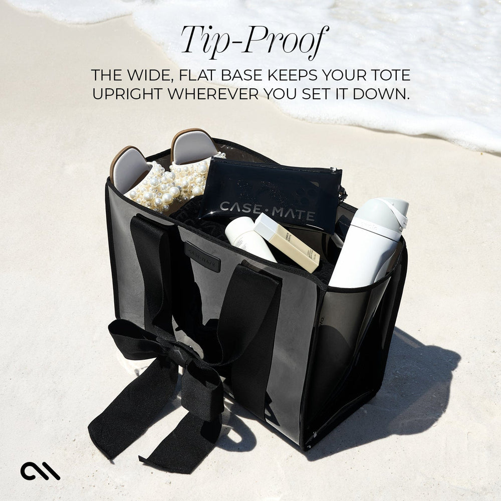 TIP PROOF. THE WIDE, FLAT BASE KEEPS YOUR TOTE UPRIGHT WHEREVER YOU SET IT DOWN #color_midnight black bow
